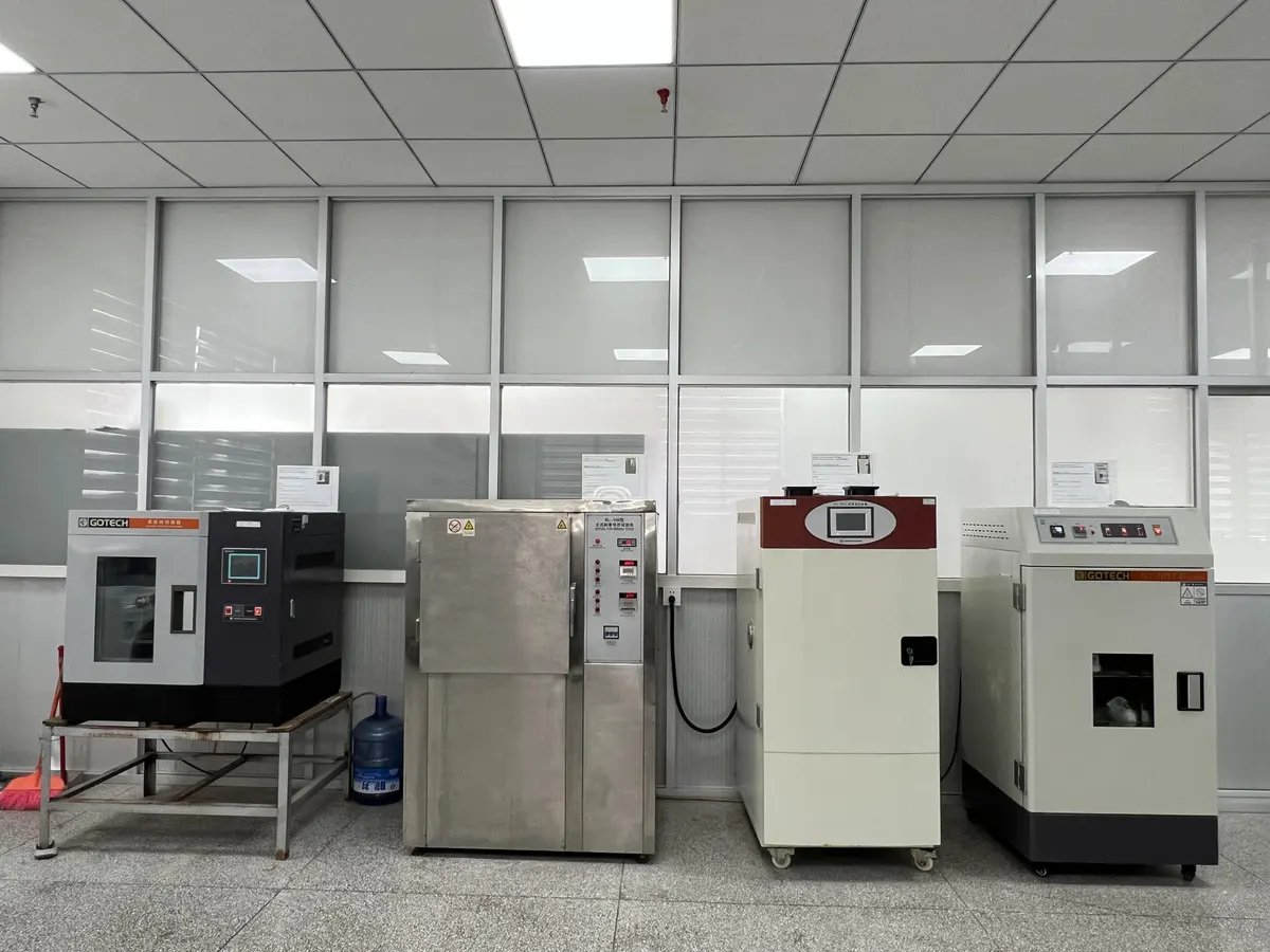 Testing-lab bench with physical-test instruments and reagent cabinet