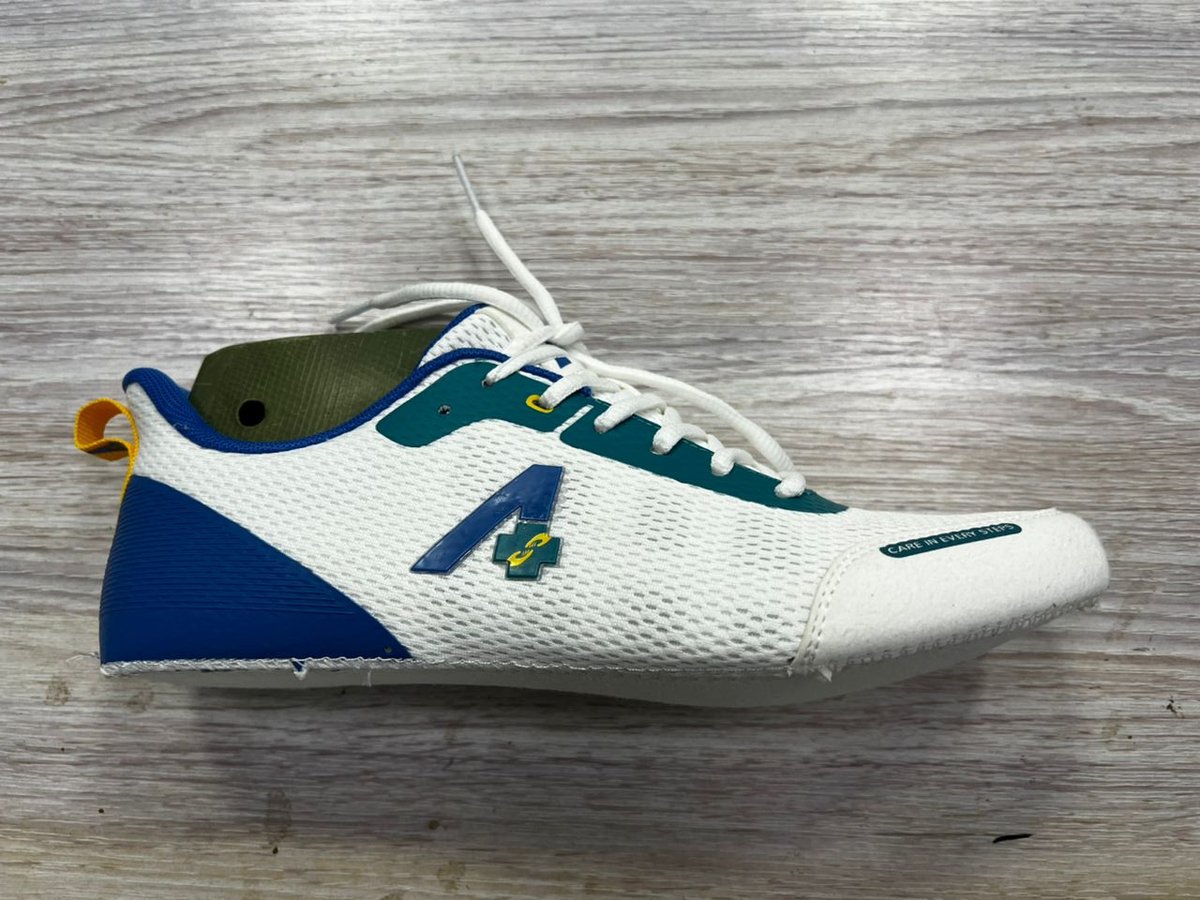 Stitched shoe upper laid flat with laces in, white mesh with teal and blue overlays, not yet lasted