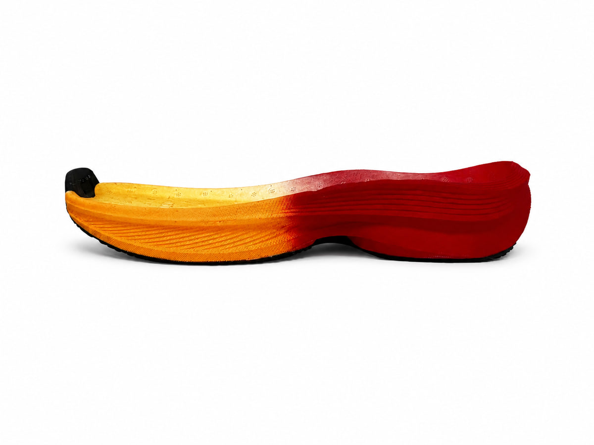 Foamed midsole in an orange-to-red gradient, seen from the side
