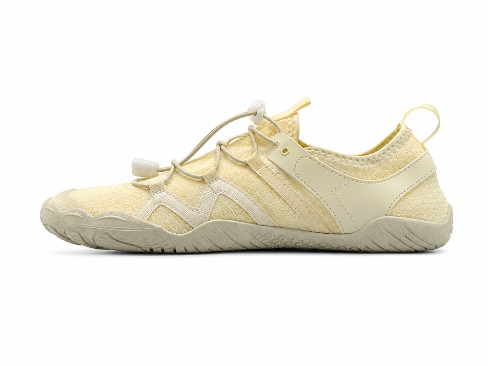 OEM/ODM barefoot water shoe in pale yellow stretch mesh with wide anatomical toe box, segmented rubber toe cap, bungee toggle lacing and thin flexible zero-drop sole, manufactured by DOING Footwear (sample 1)
