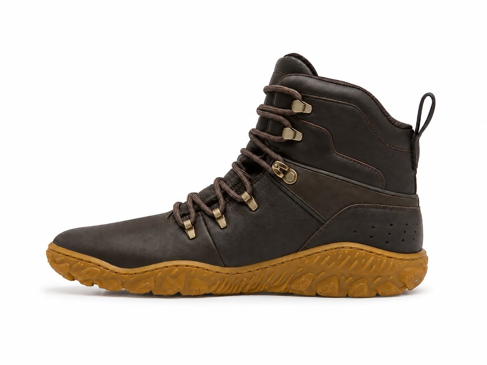 Dark brown leather barefoot hiking boot with a wide anatomical toe box, brass lace hooks and a thin flexible lugged gum outsole, developed to customer drawings by DOING Footwear