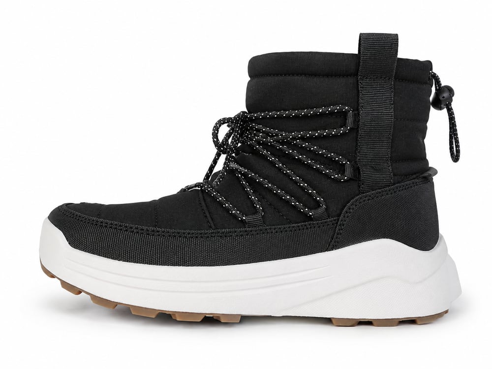 Black quilted winter boot with reflective laces, a webbing heel pull loop and a gum lug outsole, developed to customer drawings by DOING Footwear